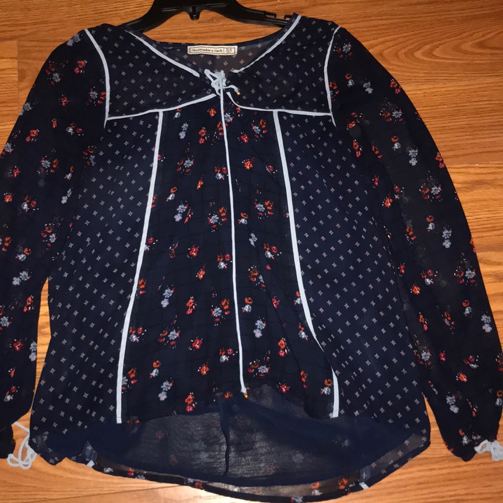 Navy blue top with floral pattern